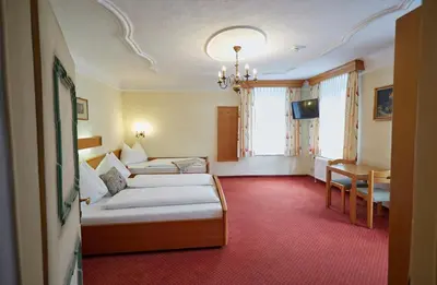 Ein Bett oder Betten in einem Zimmer der Unterkunft Hotel Gasthof Stenitzer