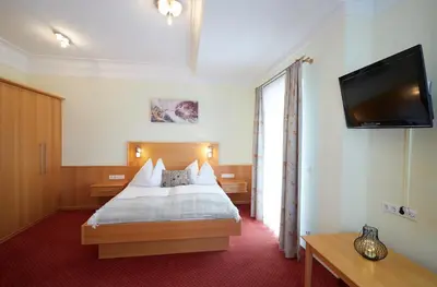 Ein Bett oder Betten in einem Zimmer der Unterkunft Hotel Gasthof Stenitzer