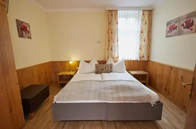 Ein Bett oder Betten in einem Zimmer der Unterkunft Hotel Gasthof Stenitzer