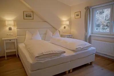 Ein Bett oder Betten in einem Zimmer der Unterkunft Appartements Stocker - Zur Schmiede