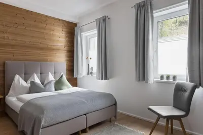 Ein Bett oder Betten in einem Zimmer der Unterkunft Das Dorf in der Stadt