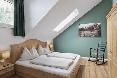 Ein Bett oder Betten in einem Zimmer der Unterkunft Das Dorf in der Stadt
