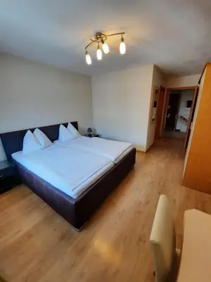 Ein Bett oder Betten in einem Zimmer der Unterkunft Pension Kreuzinger, 5310 Tiefgraben
