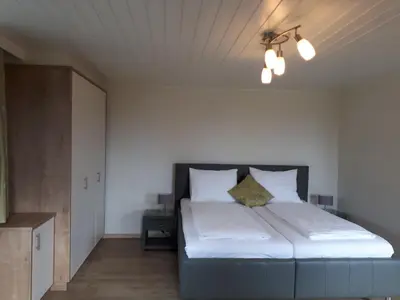 Ein Bett oder Betten in einem Zimmer der Unterkunft Pension Kreuzinger, 5310 Tiefgraben
