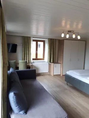 Ein Bett oder Betten in einem Zimmer der Unterkunft Pension Kreuzinger, 5310 Tiefgraben