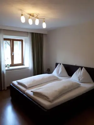Ein Bett oder Betten in einem Zimmer der Unterkunft Pension Kreuzinger, 5310 Tiefgraben