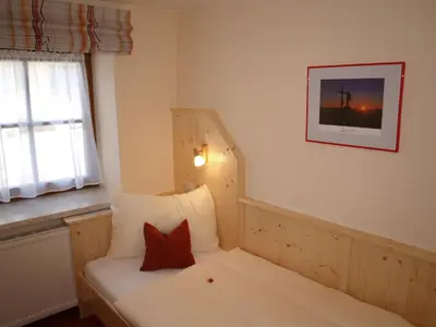 Ein Bett oder Betten in einem Zimmer der Unterkunft Simonegg