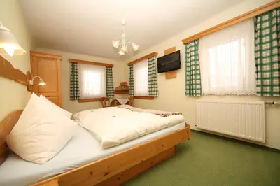 Ein Bett oder Betten in einem Zimmer der Unterkunft Aignerhof