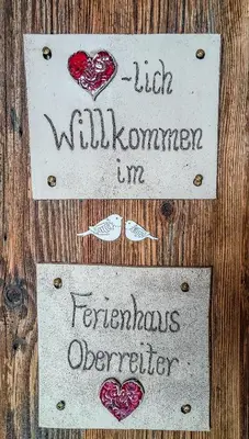 Ein Zertifikat, Auszeichnung, Logo oder anderes Dokument, das in der Unterkunft Ferienhaus Helmuth Oberreiter ausgestellt ist
