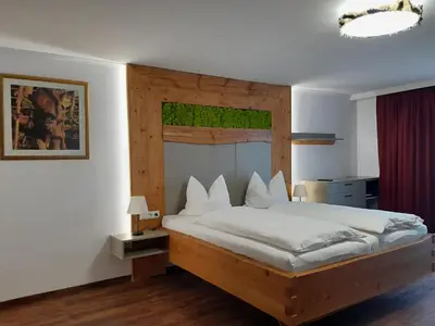 Ein Bett oder Betten in einem Zimmer der Unterkunft Gasthofladen Schneeweiss