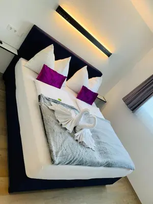 Ein Bett oder Betten in einem Zimmer der Unterkunft ImPuls | aparts