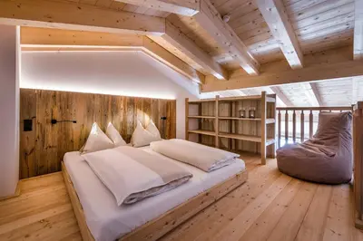 Ein Bett oder Betten in einem Zimmer der Unterkunft almlust - hotel, apartments, chalets