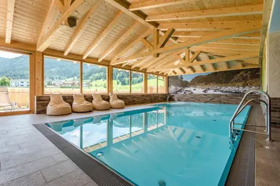 Der Swimmingpool an oder in der Nähe von almlust - hotel, apartments, chalets