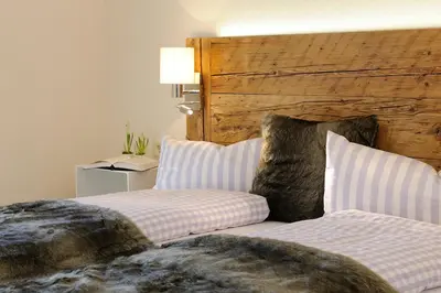 Ein Bett oder Betten in einem Zimmer der Unterkunft Luxuslodge - Zeit zum Leben