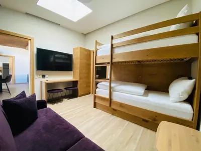 Ein Bett oder Betten in einem Zimmer der Unterkunft AlpinLodge Flachau