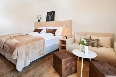 Ein Bett oder Betten in einem Zimmer der Unterkunft AlpinLodge Flachau