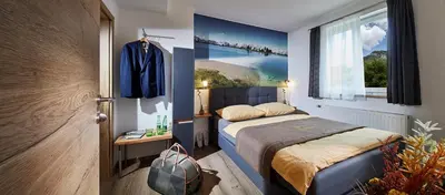 Ein Bett oder Betten in einem Zimmer der Unterkunft Landgasthof Klausner