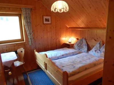Ein Bett oder Betten in einem Zimmer der Unterkunft Kleines Ferienhaus Koglerhütte