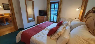 Ein Bett oder Betten in einem Zimmer der Unterkunft Schlosserhaus Appartements