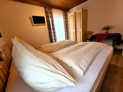 Ein Bett oder Betten in einem Zimmer der Unterkunft Pension Sydler