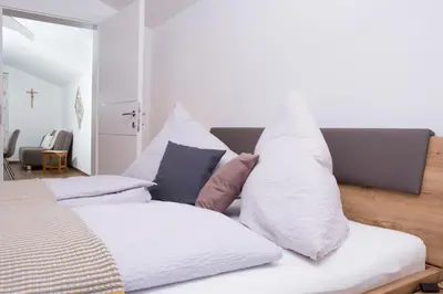 Ein Bett oder Betten in einem Zimmer der Unterkunft Oberschartlhof