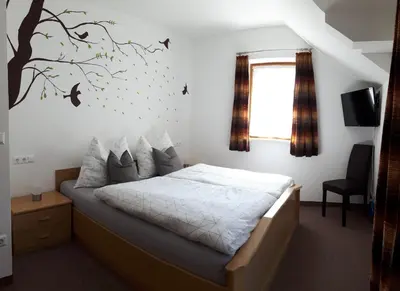 Ein Bett oder Betten in einem Zimmer der Unterkunft Vordermuhr 34
