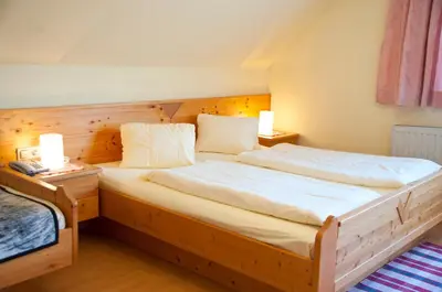 Ein Bett oder Betten in einem Zimmer der Unterkunft Pension Pürcherhof