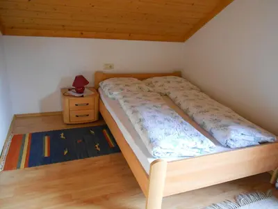 Ein Bett oder Betten in einem Zimmer der Unterkunft Ferienwohnung Schmiedbauer