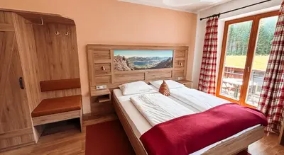Ein Bett oder Betten in einem Zimmer der Unterkunft Hotel Garni Pension zur Wacht