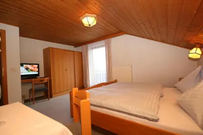 Ein Bett oder Betten in einem Zimmer der Unterkunft Hotel-Café Perner