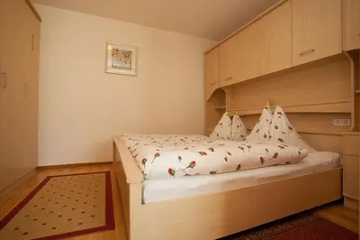 Ein Bett oder Betten in einem Zimmer der Unterkunft Familiengästehaus Ingrid