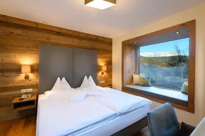 Ein Bett oder Betten in einem Zimmer der Unterkunft Gut Berg Naturhotel