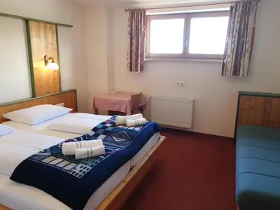 Ein Bett oder Betten in einem Zimmer der Unterkunft Berghotel Türlwand
