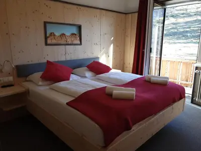 Ein Bett oder Betten in einem Zimmer der Unterkunft Berghotel Türlwand