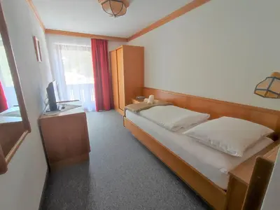 Ein Bett oder Betten in einem Zimmer der Unterkunft Berghotel Türlwand