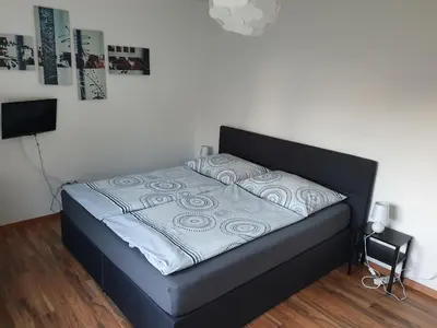 Ein Bett oder Betten in einem Zimmer der Unterkunft Bogi's Ferienhaus - Pension