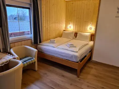 Ein Bett oder Betten in einem Zimmer der Unterkunft Haus Alpenrose
