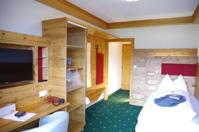 Ein Bett oder Betten in einem Zimmer der Unterkunft Hotel Berghof