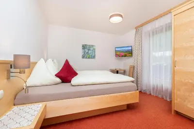 Ein Bett oder Betten in einem Zimmer der Unterkunft Ferienhaus Eva