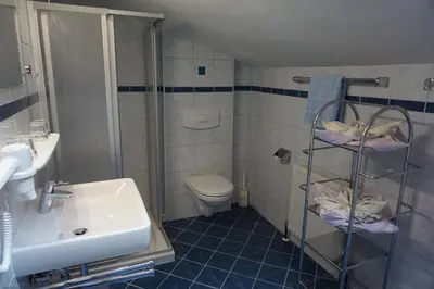 Ein Badezimmer in der Unterkunft Pension Arnika