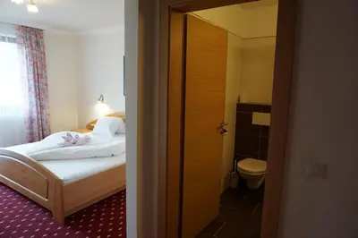 Ein Bett oder Betten in einem Zimmer der Unterkunft Pension Arnika