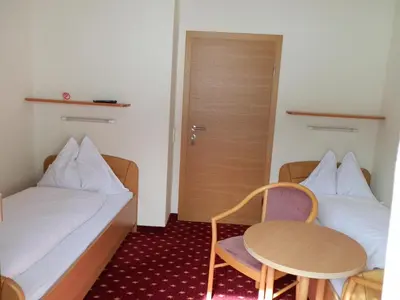 Ein Bett oder Betten in einem Zimmer der Unterkunft Pension Arnika