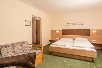 Ein Bett oder Betten in einem Zimmer der Unterkunft Hotel Starchlhof