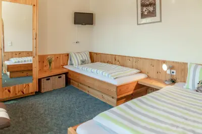 Ein Bett oder Betten in einem Zimmer der Unterkunft Familienhotel Unterreith
