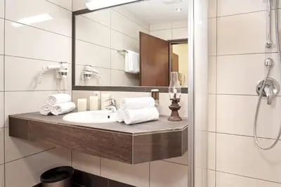 Ein Badezimmer in der Unterkunft Aparthotel Dachsteinblick