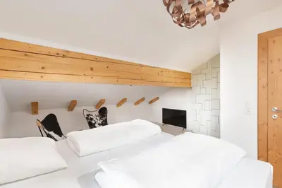 Ein Bett oder Betten in einem Zimmer der Unterkunft Designferienhaus Luxus Bergchalet XXL Ski In-Out Snow Space Wagrain Flachau