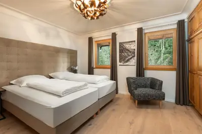 Ein Bett oder Betten in einem Zimmer der Unterkunft Designferienhaus Luxus Bergchalet XXL Ski In-Out Snow Space Wagrain Flachau