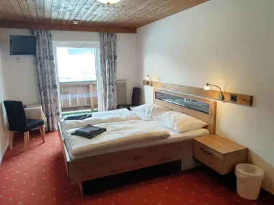 Ein Bett oder Betten in einem Zimmer der Unterkunft Landgasthof Hotel Zehenthof