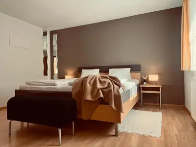Ein Bett oder Betten in einem Zimmer der Unterkunft Dependance I