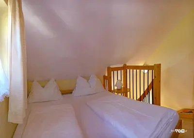 Ein Bett oder Betten in einem Zimmer der Unterkunft Dependance II